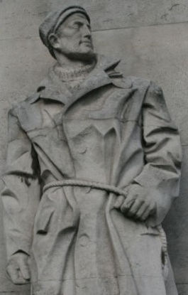 Memorial statue depicting a seaman in duffle coat at Tower Hill Memorial, London